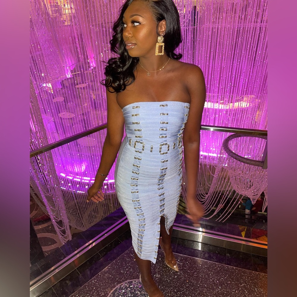 Baby blue bandage dress with gold buckles.